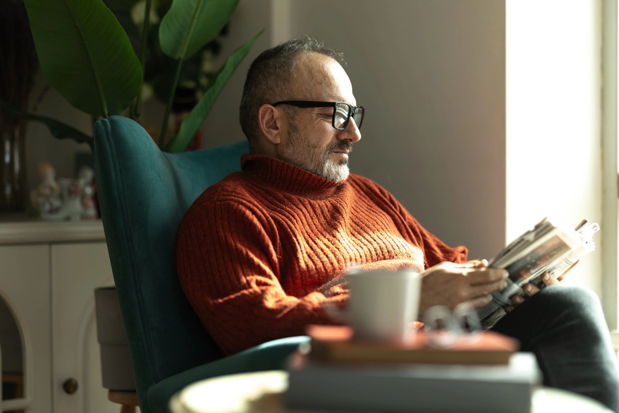 Customer portrait reading in an armchair
